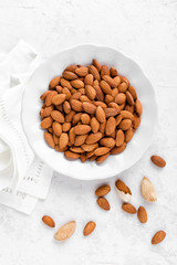 Almond nuts on white background directly above flat lay