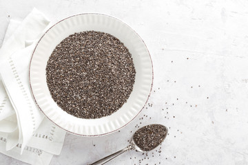 Chia seeds on white baclground directly above copy space