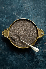 Chia seeds on dark baclground directly above copy space