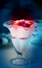 Delicious curd dessert with strawberries and blueberries