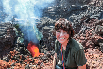 The boiling magma flows through lava tubes under a layer of cooled lava - volcano Tolbachik,...