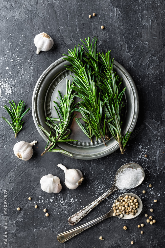 Poster rosemary, garlic, salt and white pepper, culinary background with various spices, directly above, fl