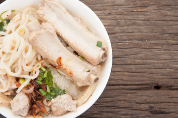 Vietnamese beef soup pho on a wooden background