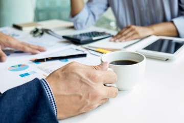 business man financial inspector and secretary making report, calculating or checking balance. Internal Revenue Service inspector checking document. Audit concept.