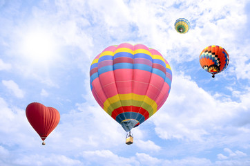 Colorful balloon over bright sky.