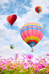 Colorful balloon over bright sky.