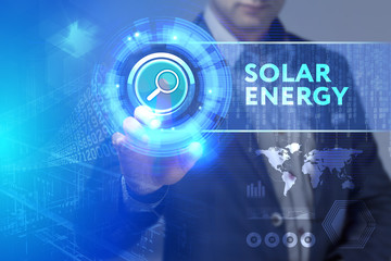 Business, Technology, Internet and network concept. Business man working on the tablet of the future, select on the virtual display: Solar energy