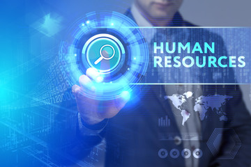 Business, Technology, Internet and network concept. Business man working on the tablet of the future, select on the virtual display: Human resources