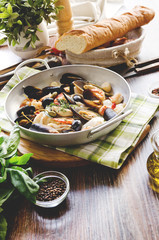 seafood. mussels, scallops, tiger prawns and squid cooked in white wine with herbs