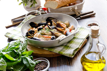 seafood. mussels, scallops, tiger prawns and squid cooked in white wine with herbs