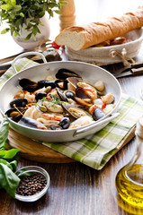 seafood. mussels, scallops, tiger prawns and squid cooked in white wine with herbs