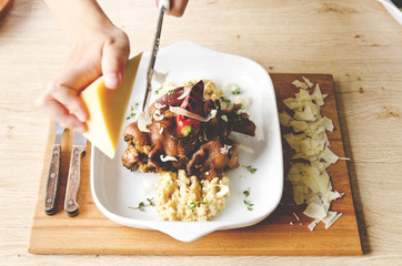 Pork leg braised in red wine. Served with bulgur and cheese