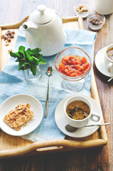 Morning tea with apricot jam and sweets