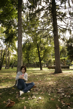 Man reluxing by tree