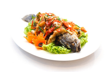 fried fish with sweet and sour sauce on white backgroung.