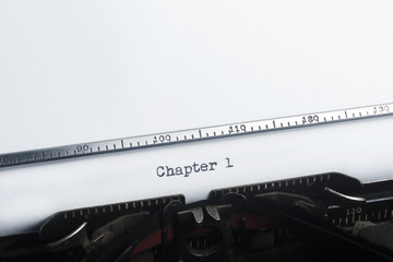 Chapter One typed. Vintage typewriter. Copyspace.