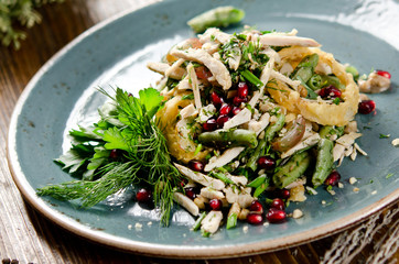 Salad with baked chicken fillet, green beans, quail eggs, grapes and pomegranate seeds