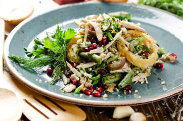 Salad with baked chicken fillet, green beans, quail eggs, grapes and pomegranate seeds
