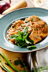 Chakhokhbili. Stewed poultry meat in tomato sauce with spices and garlic