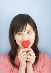Woman Holding Heart Shaped Toy