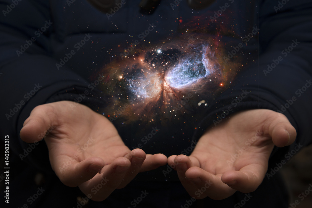 Wall mural the vast universe in the hands of a child. elements of this image furnished by nasa.