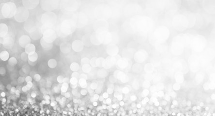 silver and white bokeh lights defocused. abstract background, wide fan page panorama format.