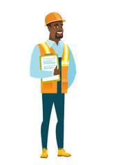 Builder holding clipboard with papers.