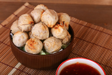 grilled meatball with spicy tamarind sauce  in bowl