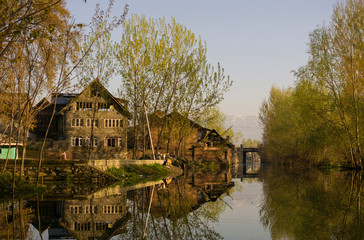 Fototapeta premium River running through rural village in India