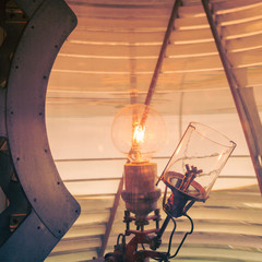 inside of a lighthouse showing the light bulb interior.