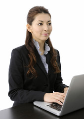 Businesswoman working on laptop