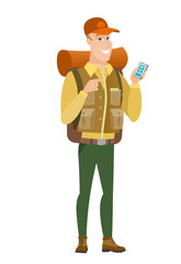 Obraz na płótnie Canvas Caucasian traveler holding a mobile phone.
