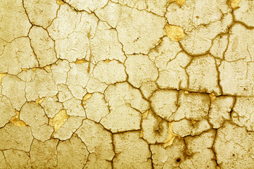 Cracked orange cement wall texture.
