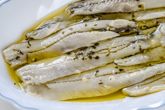 a pile of anchovies in vinegar