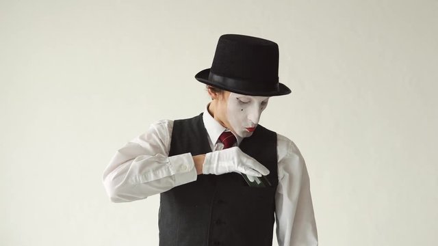 man MIM takes from his pocket a credit card. Manipulation of credit cards on white background