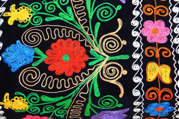 multi-colored embroidery on black