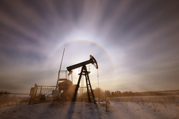 oil pump in a snowy field