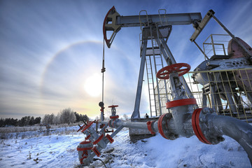 oil pump in a snowy field - 141000954