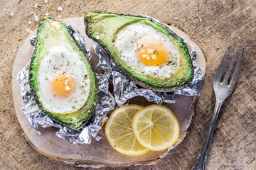 Chicken egg baked in avocado.