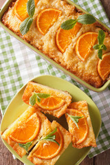 Naklejka na ściany i meble Sliced Greek Orange Pie With Phyllo - Portokalopita close-up. Vertical top view
