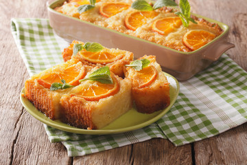 Delicious orange pie syrup soaked close-up. horizontal