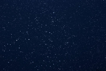 snow on a black background