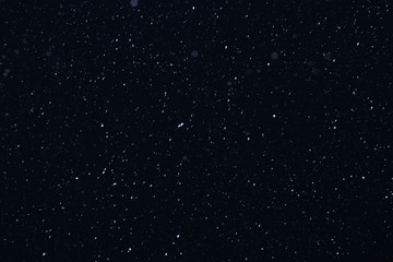 snow on a black background