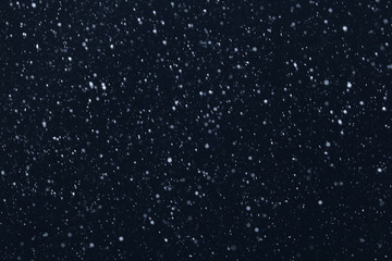 snow on a black background