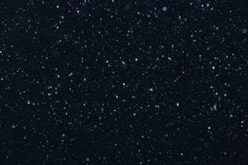 snow on a black background