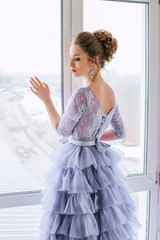 Beautiful girl in evening lilac dress