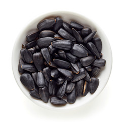 Bowl of black sunflower seeds from above