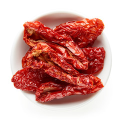 Bowl of sun dried tomatoes from above - obrazy, fototapety, plakaty