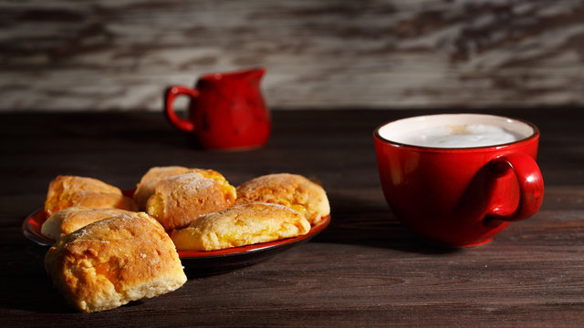 Homemade cookies and coffee on wooden table.