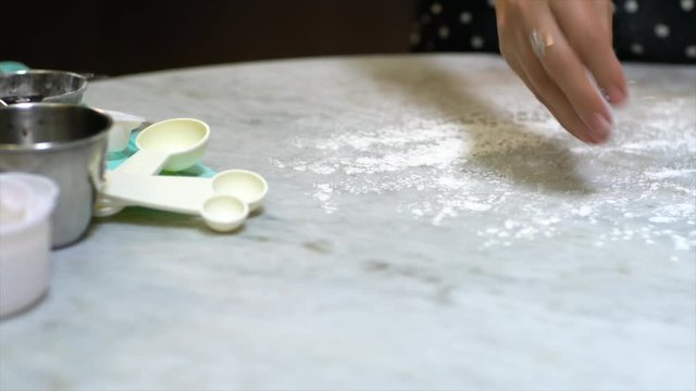 Woman kneading dough on the table. Making Pizza Dough Series. 